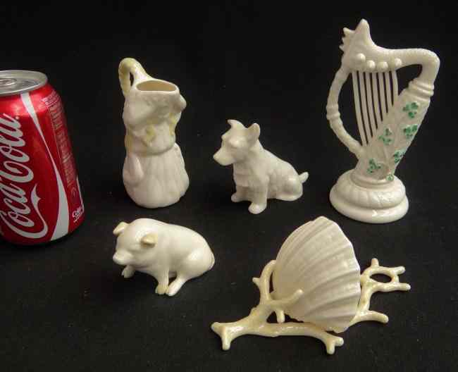 Appraisal: Lot five pieces Irish Belleek including harp pig dog figural