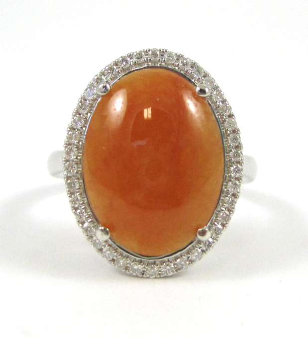 Appraisal: ORANGE JADE AND FOURTEEN KARAT GOLD RING The K white