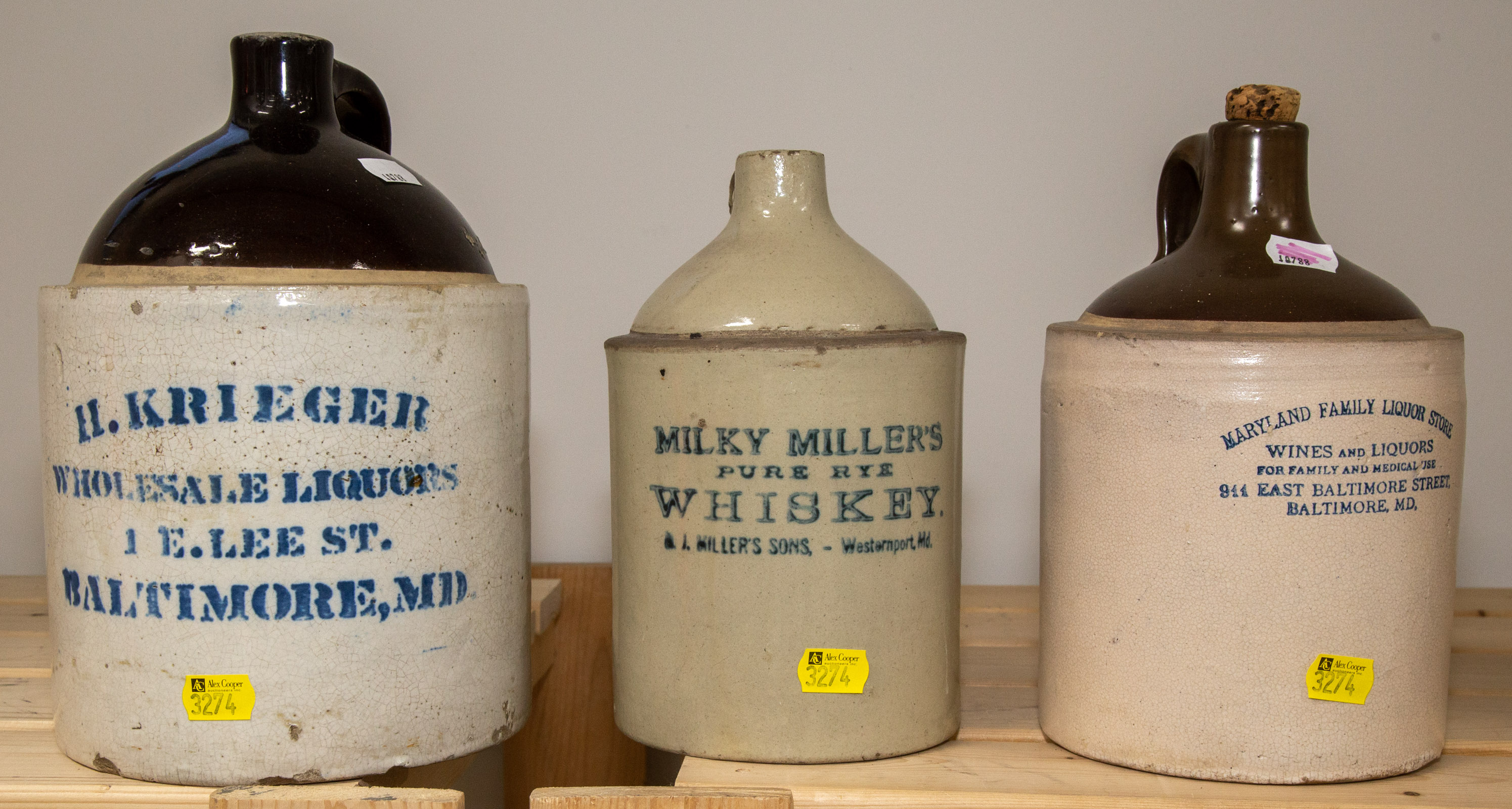 Appraisal: THREE MARYLAND LABELED STONEWARE JUGS Includes MARYLAND FAMILY LIQUOR STORE