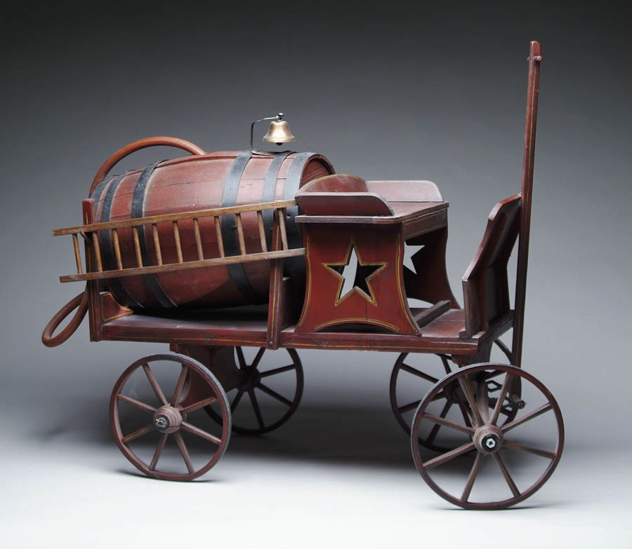 Appraisal: INTERESTING PAINTED FOLK ART FIRE WAGON The wagon has red