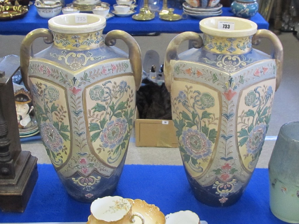 Appraisal: Pair of Japanese two handled vases with tube lined decoration