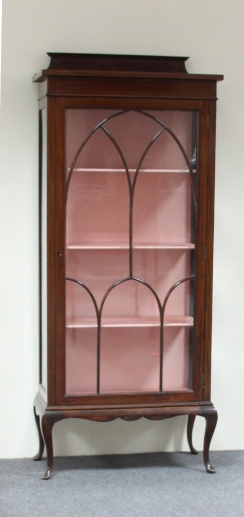 Appraisal: A mahogany display cabinet the glazed panel door enclosing shelves