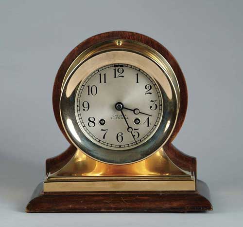 Appraisal: CHELSEA BRASS SHIP S CLOCK Brass case mounted against a