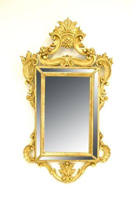 Appraisal: An Italian giltwood wall mirror with shell scroll and foliage