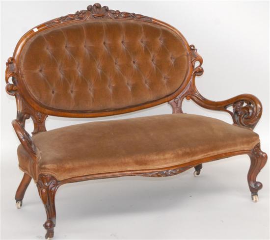 Appraisal: CARVED VICTORIAN SETTEE Walnut with vine and feather crest heavily