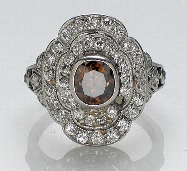 Appraisal: A colored diamond and diamond ring estimated total diamond weight