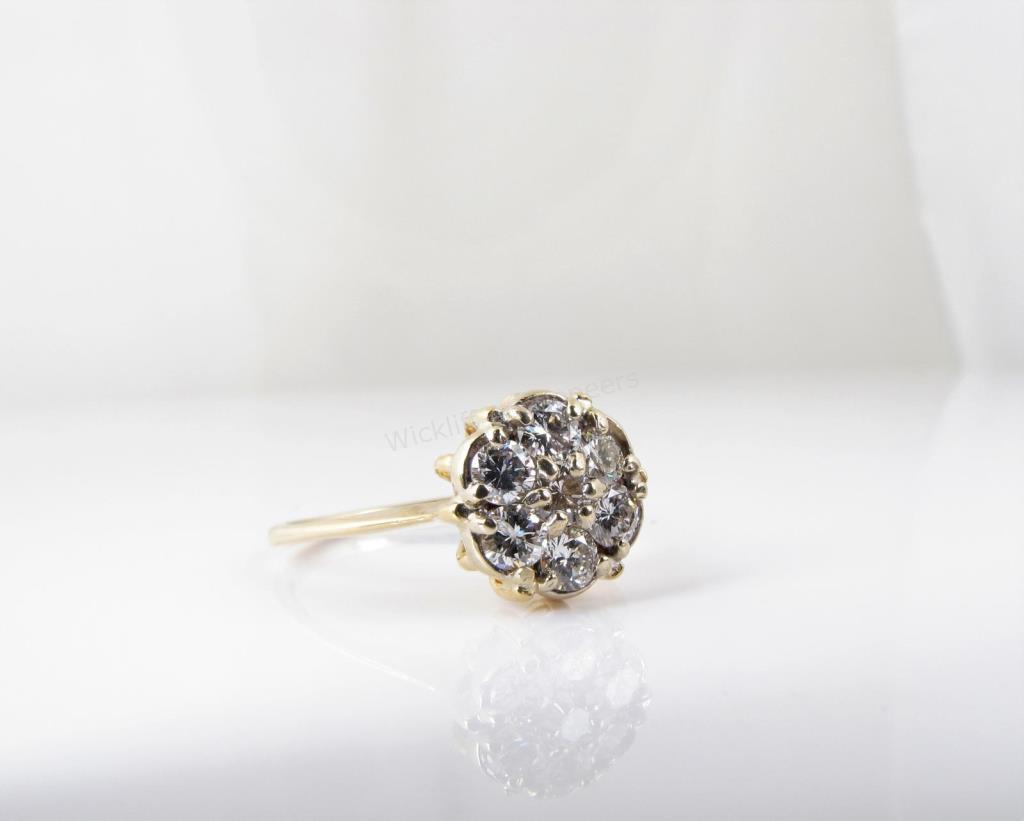 Appraisal: A K yellow gold diamond ring with five round diamonds