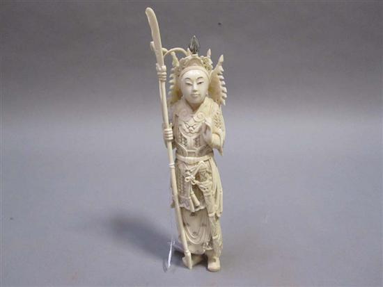 Appraisal: IVORY CARVED FIGURE A warrior holding a spear in his