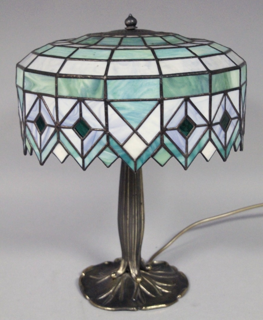 Appraisal: A modern Tiffany design table lamp with domed cover decorated