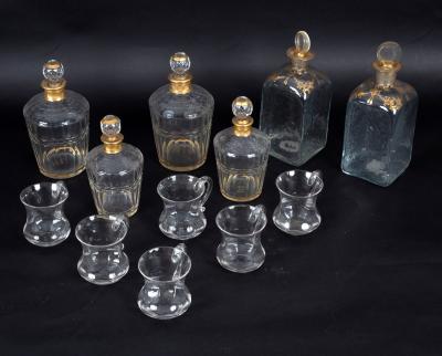 Appraisal: A set of four decanters and stoppers with gilt collars