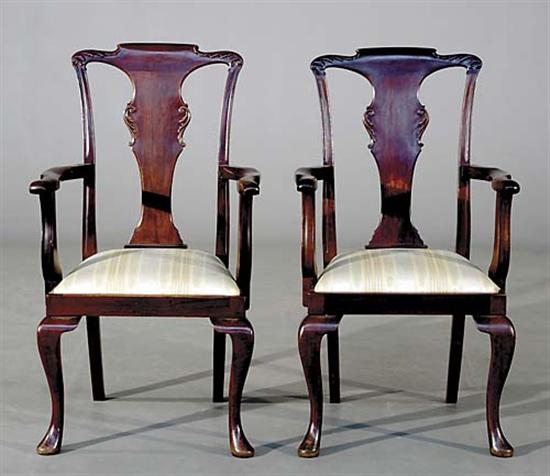 Appraisal: Pair English carved mahogany armchairs late th centuryscrolled crest and