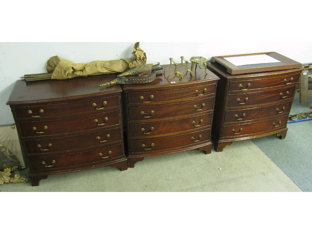 Appraisal: Set of three mahogany bow fronted four drawer chests