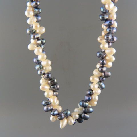 Appraisal: Pearl Necklace black white acorn shaped pearls long