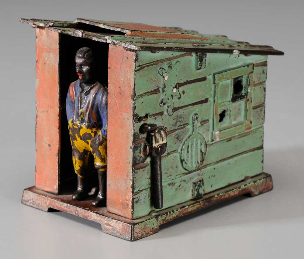 Appraisal: Cast Iron Mechanical Bank Black Man at a Cabin American