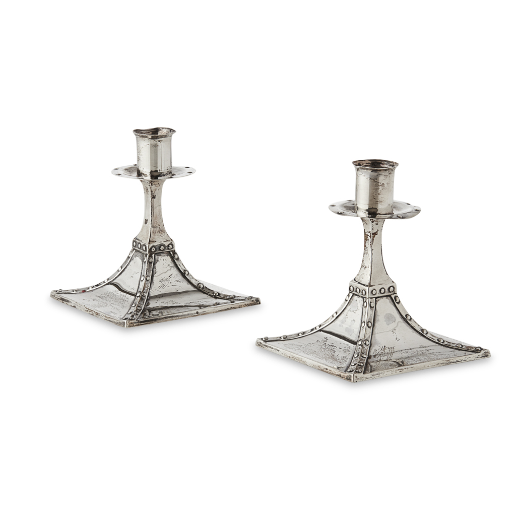 Appraisal: ROBERT WILLIAM SORLEY GLASGOW PAIR OF ARTS CRAFTS SILVER CANDLESTICKS