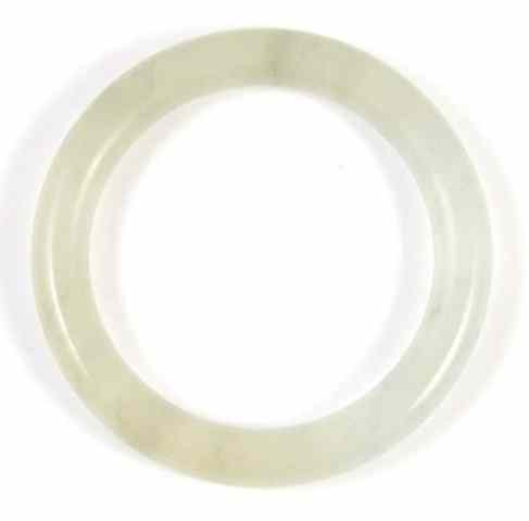 Appraisal: LIGHT GREEN TRANSLUCENT JADE BANGLE The round bangle is -