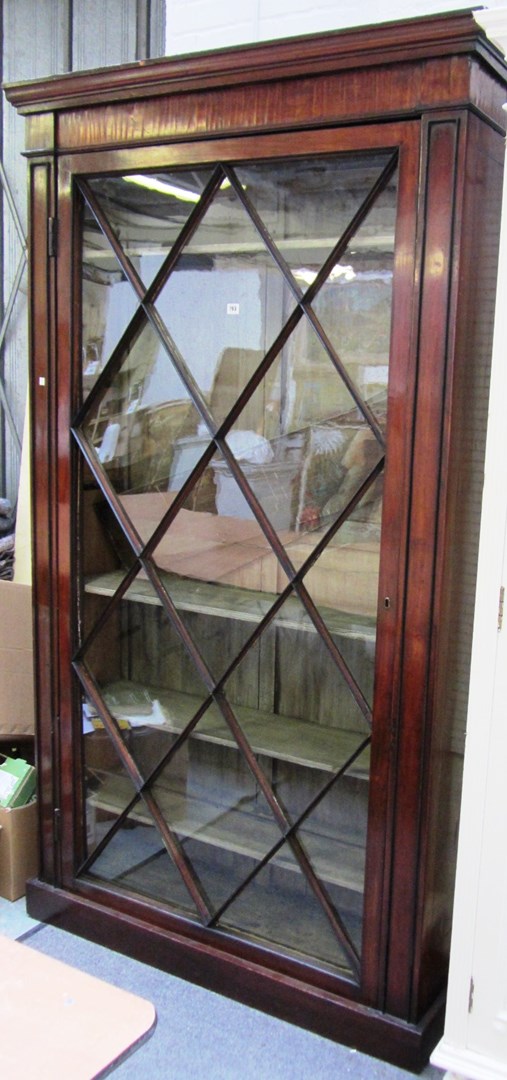 Appraisal: An early th century mahogany floor standing glazed bookcase on