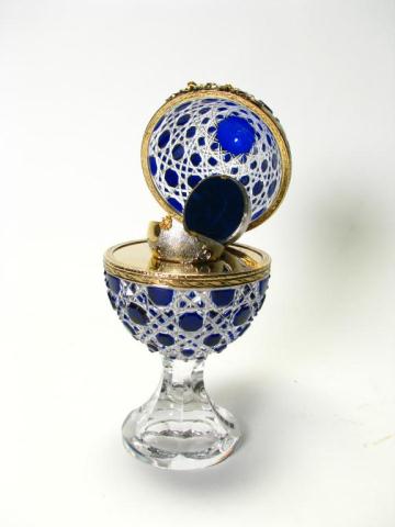 Appraisal: Faberge Millennium crystal cobalt-cut-to-clear egg on clear pedestal gilt metal