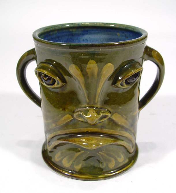 Appraisal: Baron Barnstaple three handled grotesque pottery face vase with incised