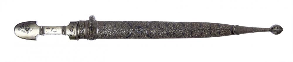 Appraisal: A PERSIAN CEREMONIAL DAGGER ornately carved silver handle and case