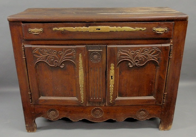 Appraisal: French Provincial style walnut cabinet with carved doors h x