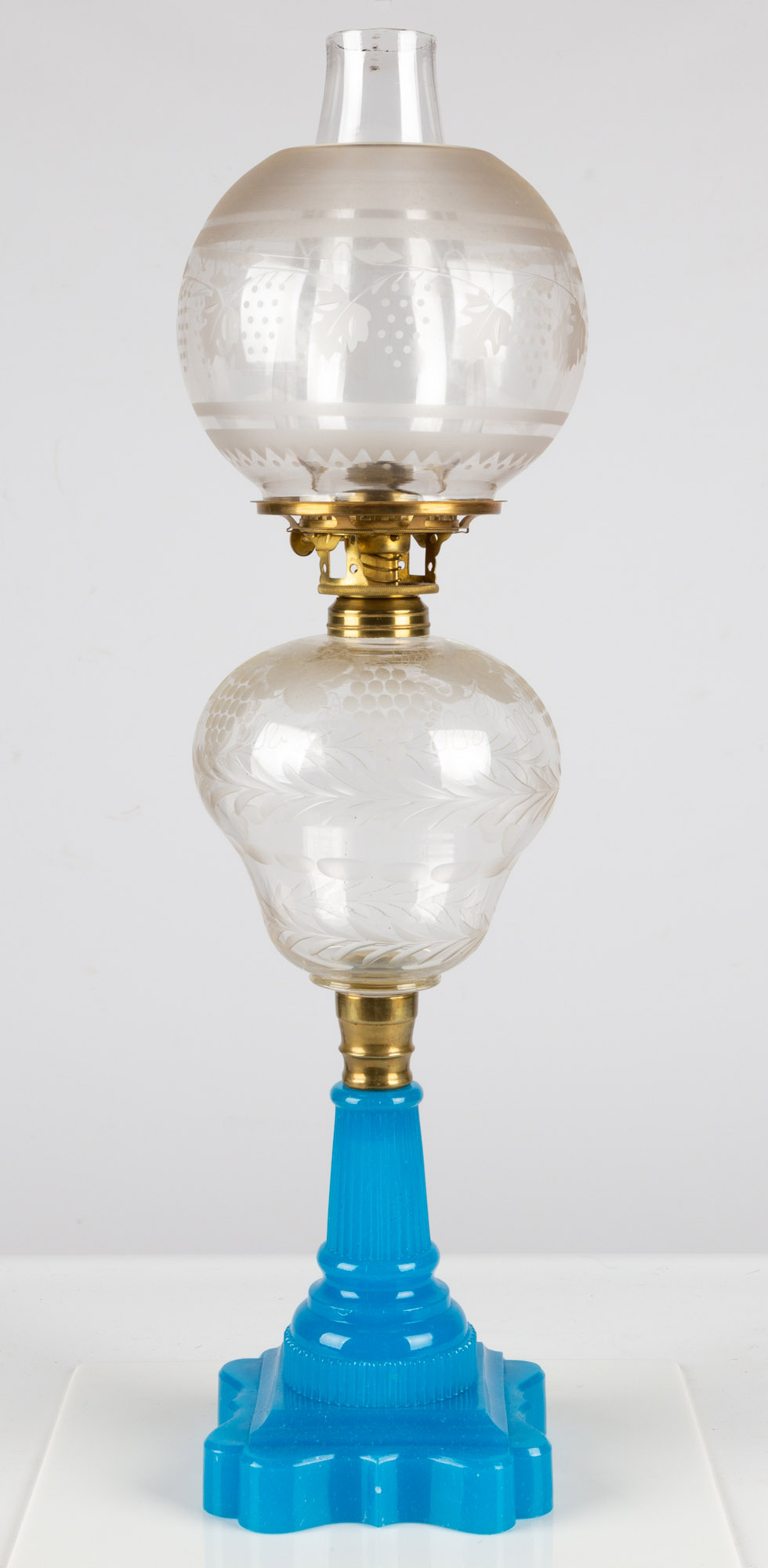 Appraisal: CLEAR AND BLUE OPALINE GLASS OIL LAMP circa clear glass