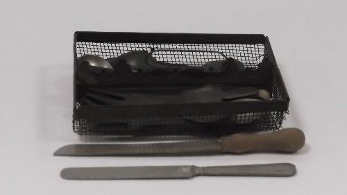 Appraisal: A miniature wirework cutlery hod containing numerous pewter and other