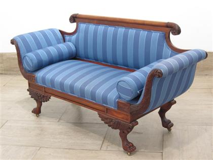 Appraisal: Classical mahogany settee Having carved crest rail terminating in rosettes