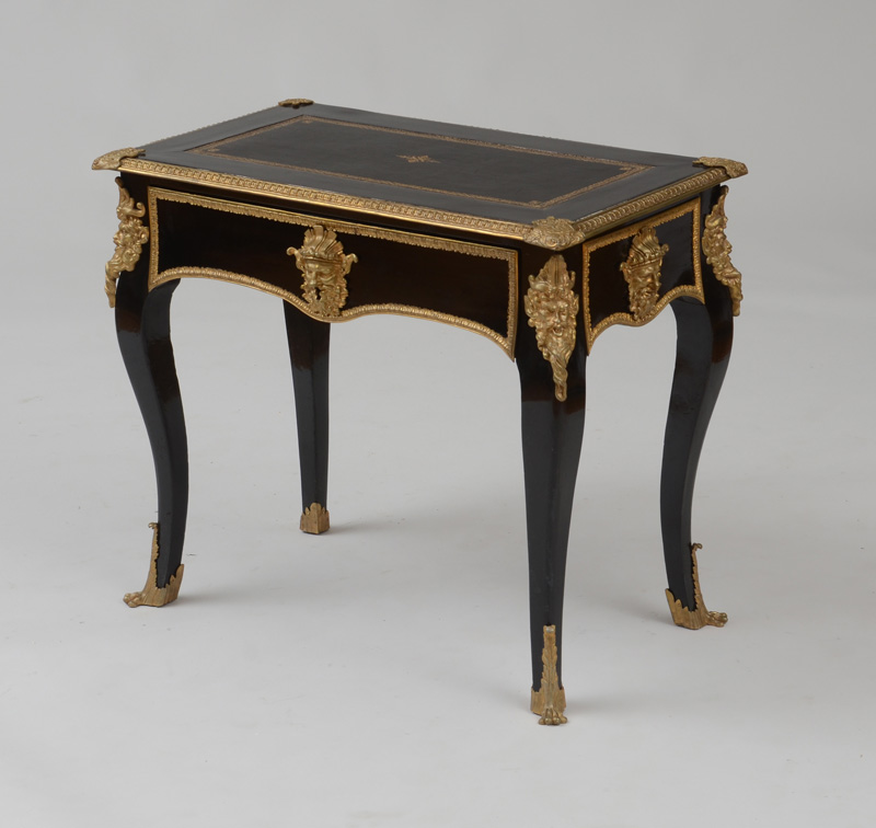 Appraisal: R GENCE STYLE ORMOLU-MOUNTED EBONIZED TABLE CRIRE With an inset