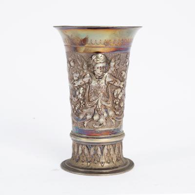 Appraisal: A German beaker circa embossed with a winged cherub wearing