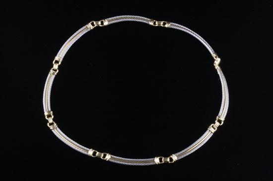 Appraisal: PHILIPPE CHARRIOL K YELLOW GOLD AND STEEL NECKLACE Choker-style necklace