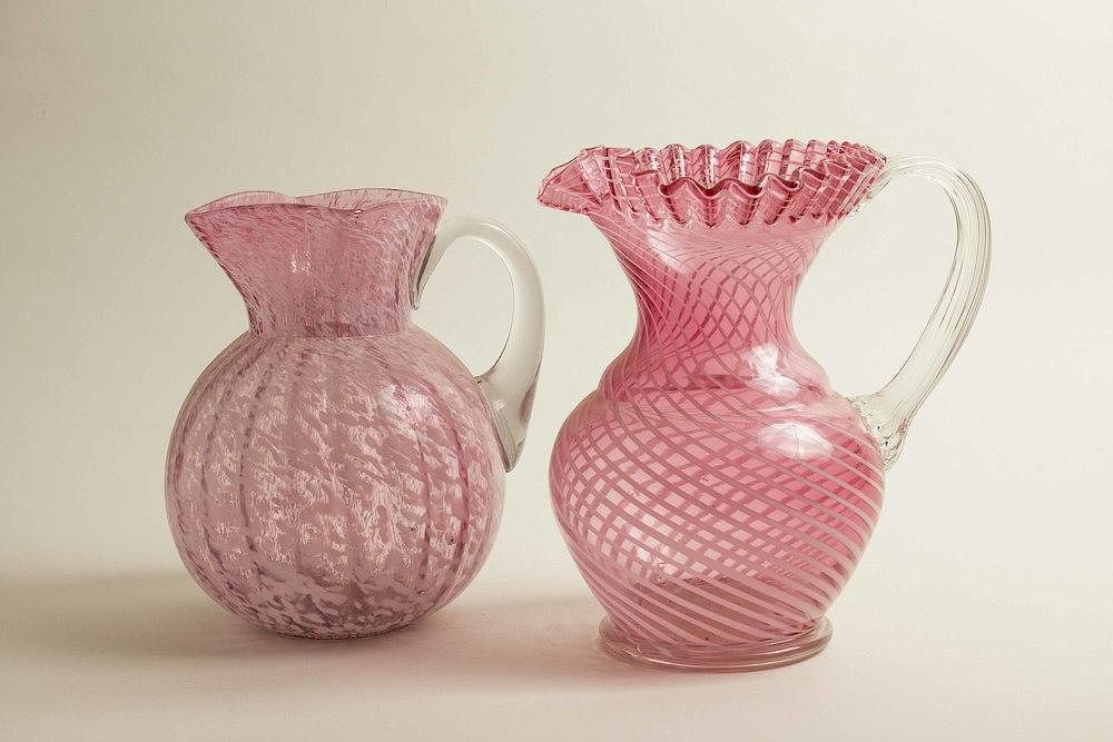 Appraisal: Two Glass Pitchers Two pink and clear glass pitchers Dimensions