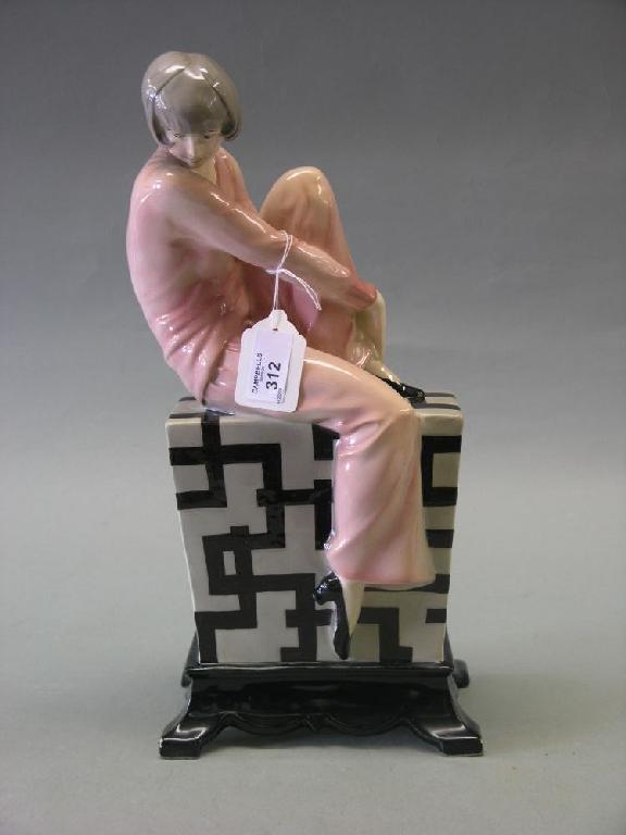 Appraisal: A Polish Art Deco style figure girl wearing pink outfit