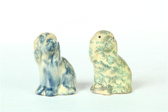 Appraisal: TWO MINIATURE POTTERY DOGS American early th century white clay