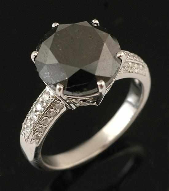 Appraisal: A solitaire black diamond ring The round brilliant cut diamond