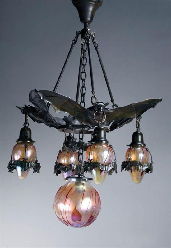 Appraisal: BRONZE BAT CHANDELIER Twentieth century An impressive chandelier with three