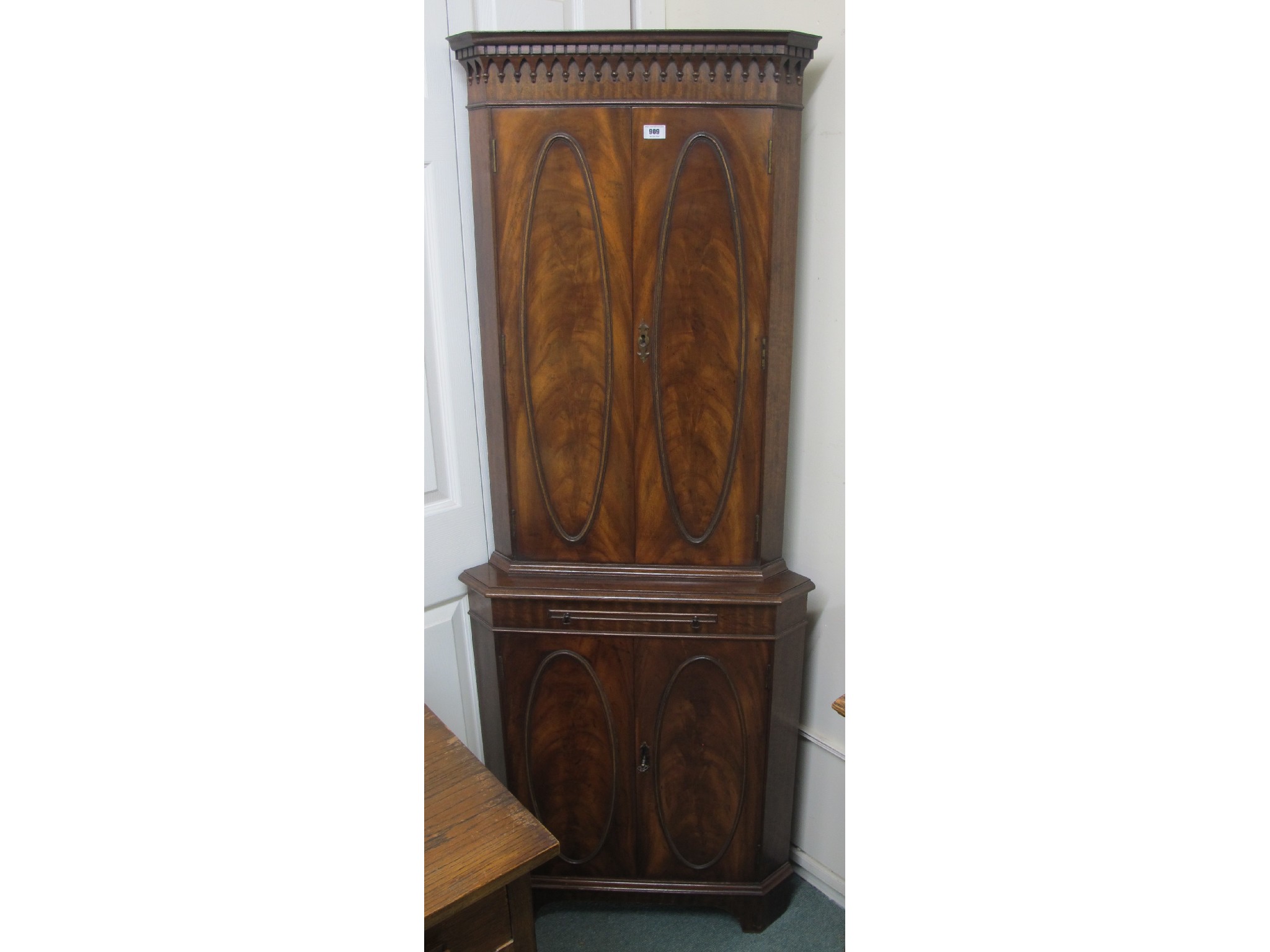 Appraisal: A mahogany Bevan and Funnell corner cabinet