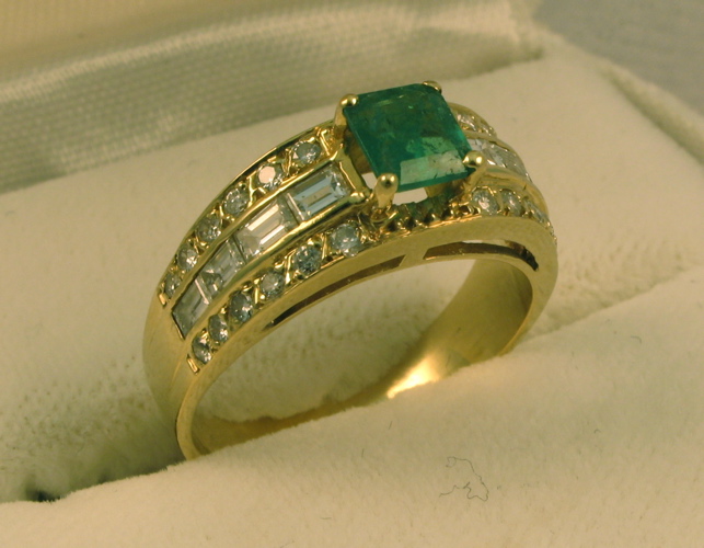 Appraisal: EMERALD DIAMOND AND FOURTEEN KARAT GOLD RING set with an