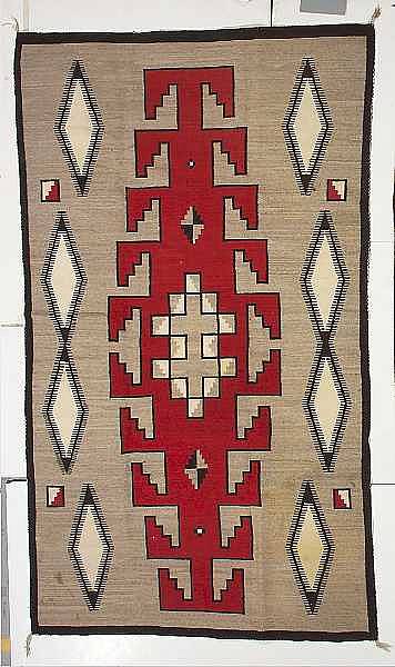 Appraisal: A Navajo Klagetoh rug With central hooked diamond medallion and