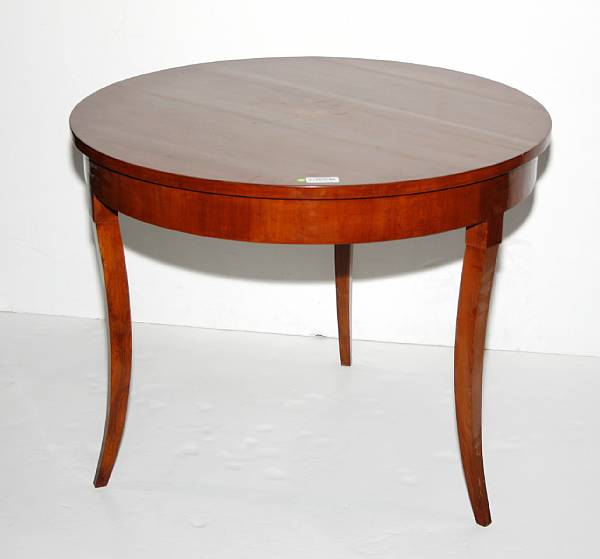 Appraisal: A Biedermeier style inlaid cherrywood center table height in diameter