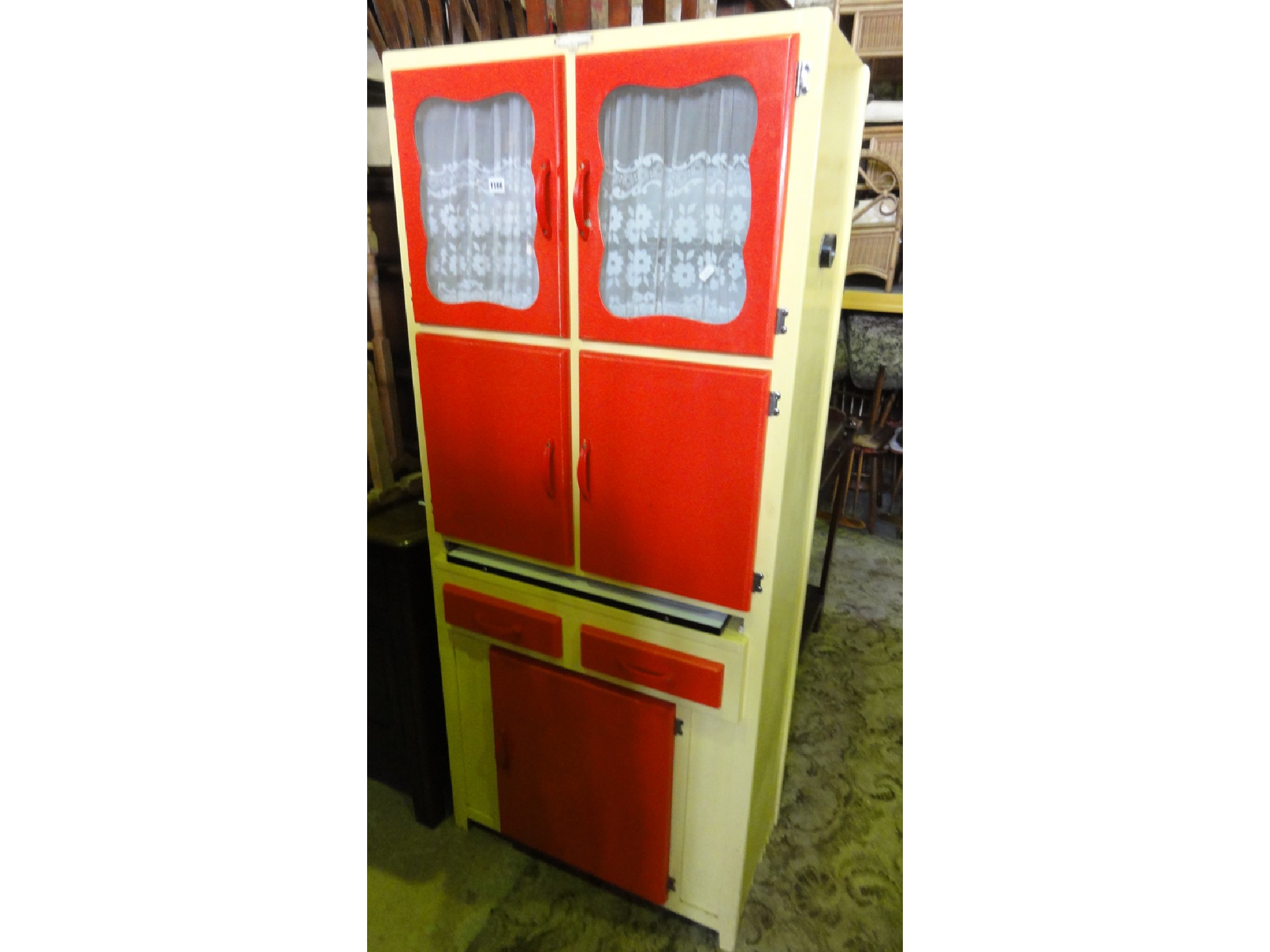 Appraisal: A vintage wooden freestanding kitchen cabinet enclosed by an arrangement