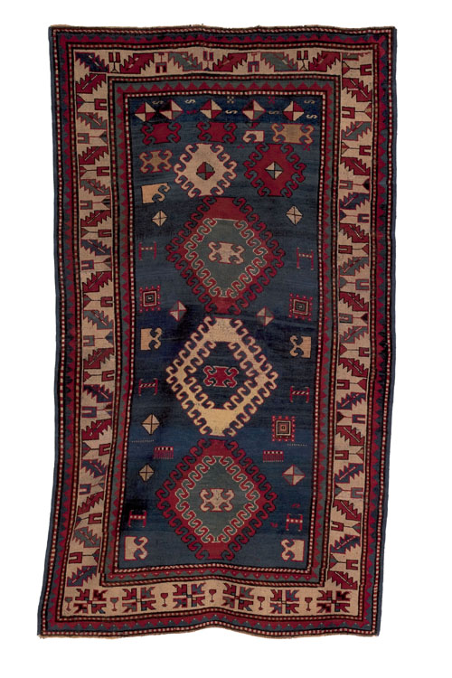 Appraisal: Kazak carpet ca with three medallions on a blue field