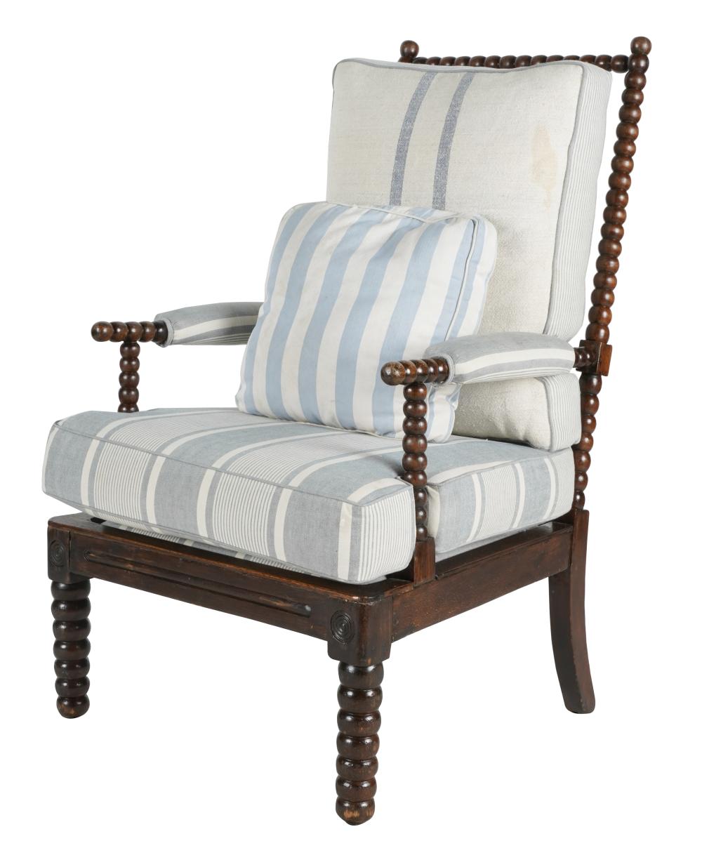 Appraisal: CURVED WOOD ARMCHAIRwith blue and white striped linen seat and