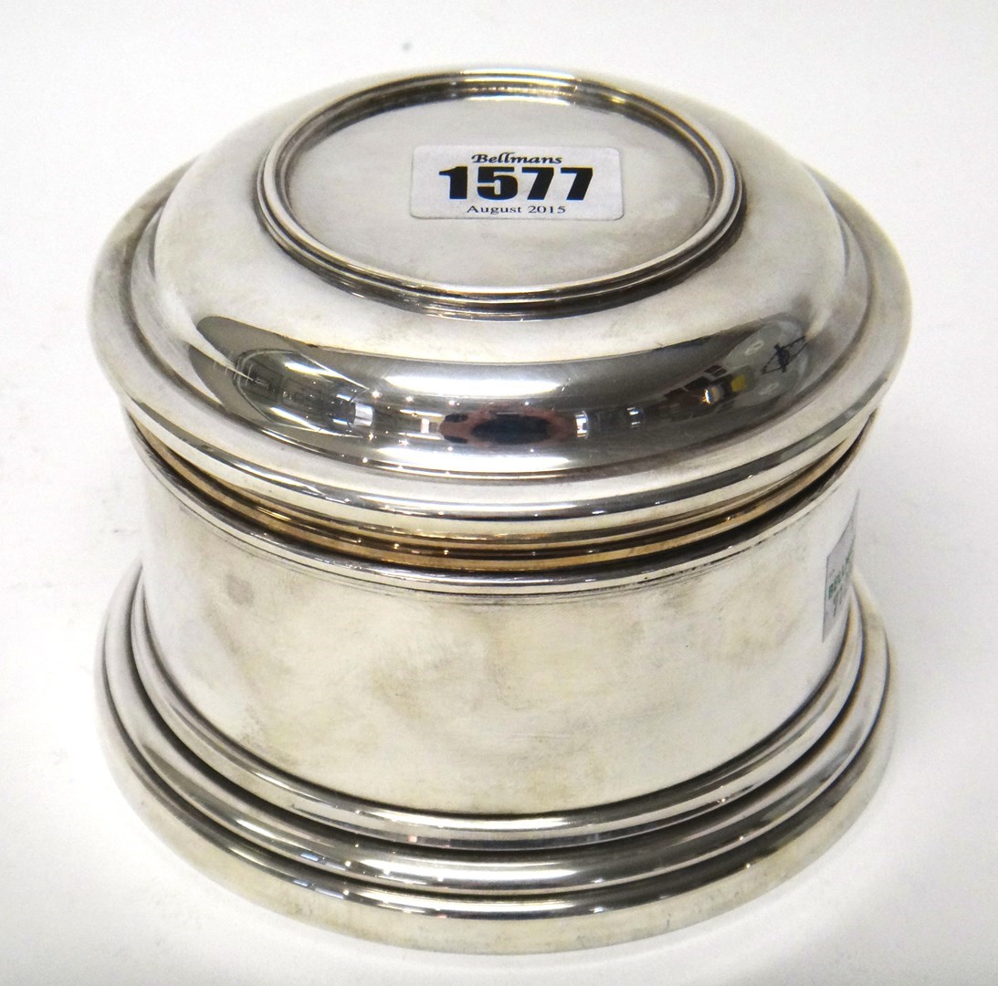 Appraisal: A silver box of cylindrical form with a pull-off lid