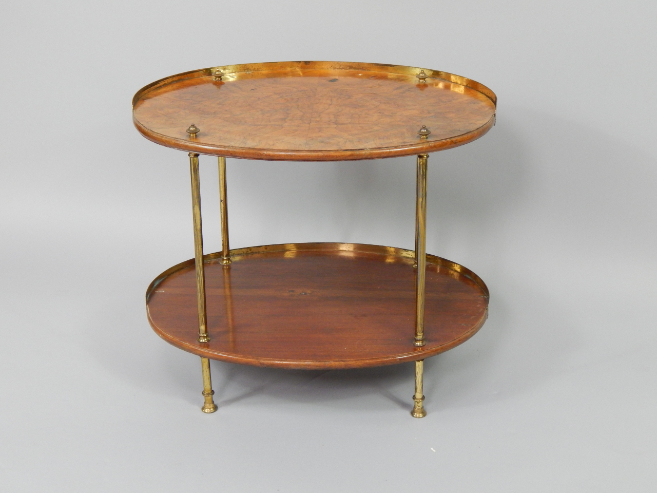 Appraisal: A Continental Art Deco walnut and brass etagere of oval