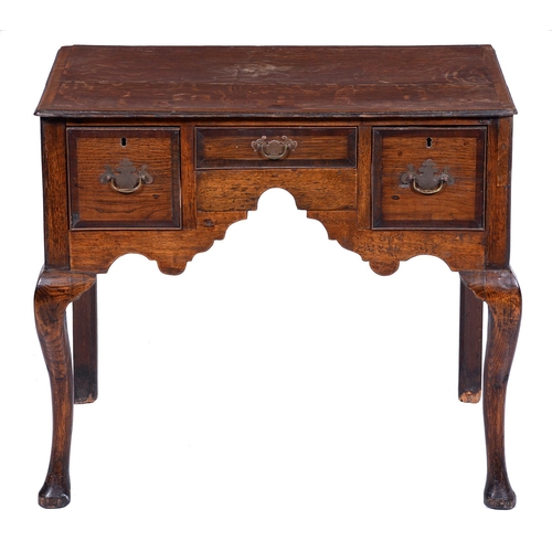 Appraisal: A George III oak and crossbanded lowboy on cabriole legs