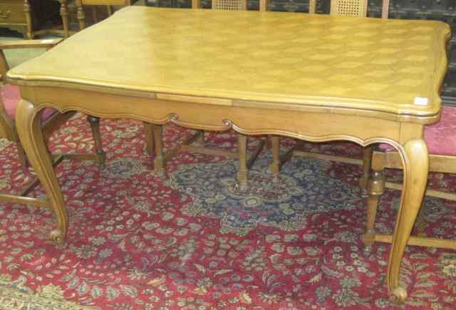 Appraisal: FRENCH PROVINCIAL STYLE OAK PARQUET DINING TABLE a rectangular draw-leaf