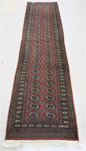 Appraisal: HAND KNOTTED ORIENTAL RUNNER Indo-Bokhara Turkoman geometric gol design arranged