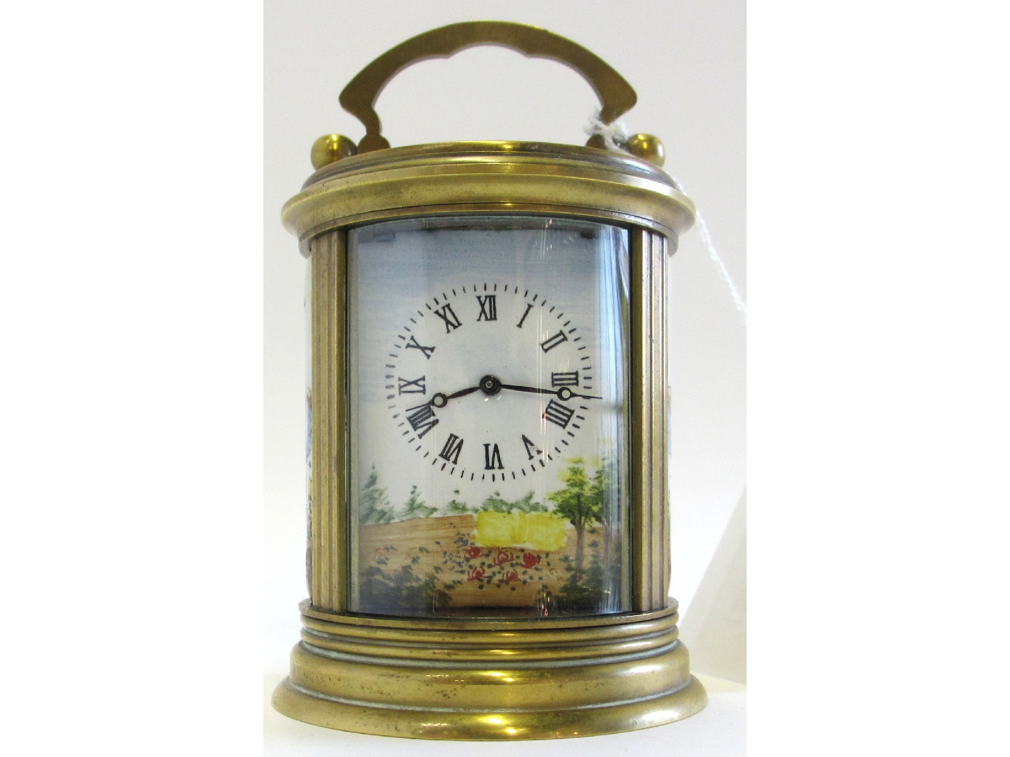 Appraisal: Brass cylinder shape carriage clock with enamel dial and porcelain