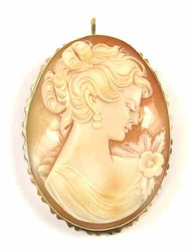 Appraisal: PORTRAIT CAMEO AND TEN KARAT GOLD PENDANT BROOCH featuring the